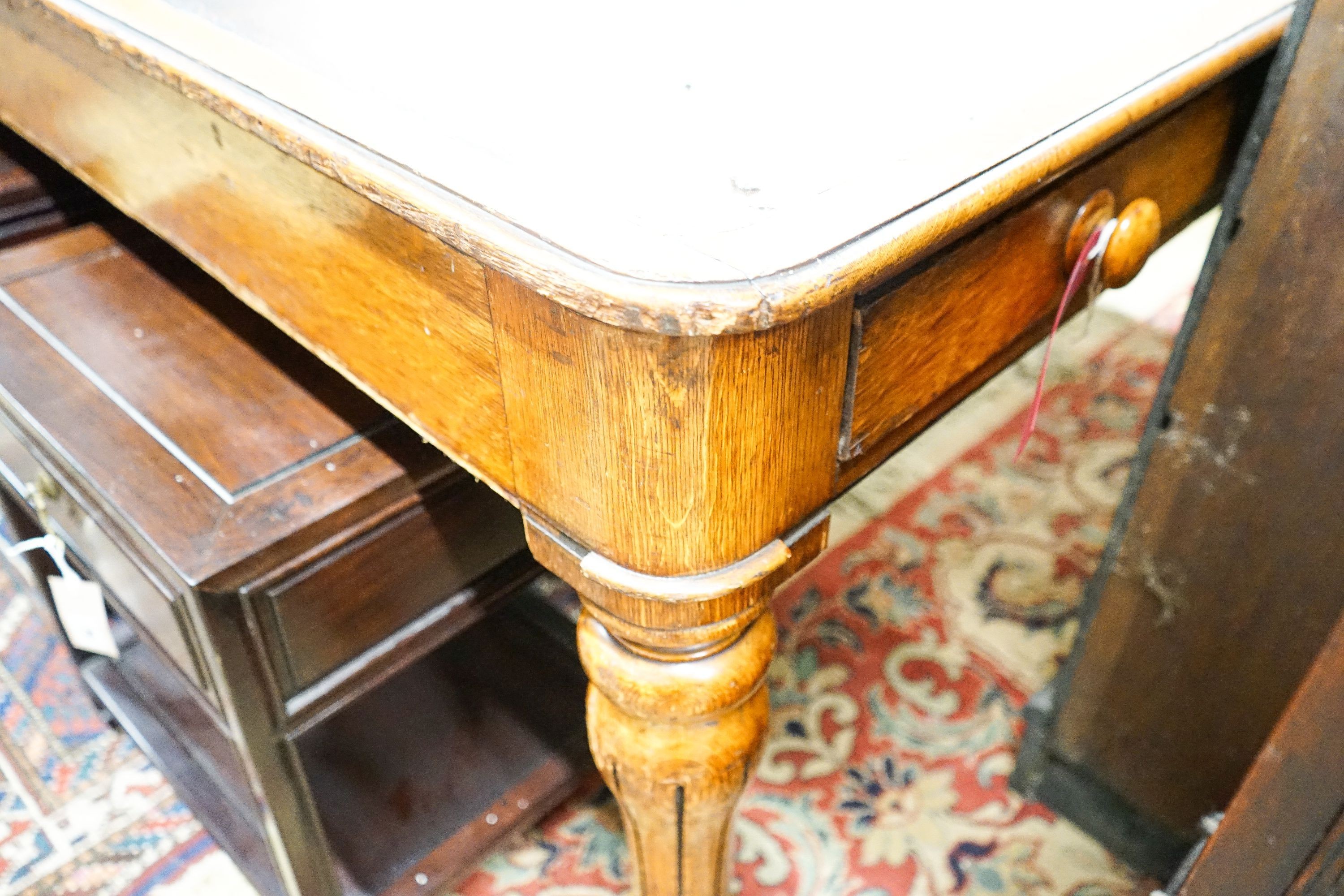 An early Victorian oak library table fitted two end drawers, from the Library of The Royal College of Surgeons, London, width 196cm, depth 105cm, height 76cm